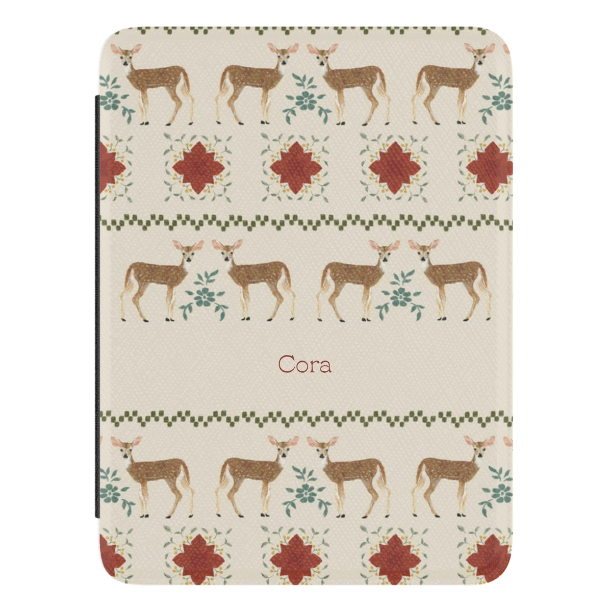 Cardigan Personalized Kindle case, close-up of the front: rows of deer and red flower motifs like a holiday sweater, on cream with the name Cora