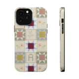 Patchwork personalized iPhone case featuring colorful geometric patterns and floral designs on a light background.