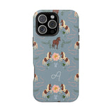Prairie personalized iPhone case featuring a blue background with horse and floral patterns, and an initial "A" design.