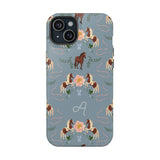 Prairie personalized iPhone case featuring a blue background with floral and horse patterns, including a monogrammed lette...