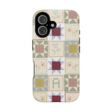 Patchwork personalized iPhone case featuring a multicolored quilt design with various geometric patterns.