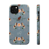 Prairie personalized iPhone case featuring a blue background with horse and floral patterns, including a monogram.