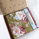2026 planner bundle featuring a floral cover, gold spiral binding, and a matching pen in a decorative box.