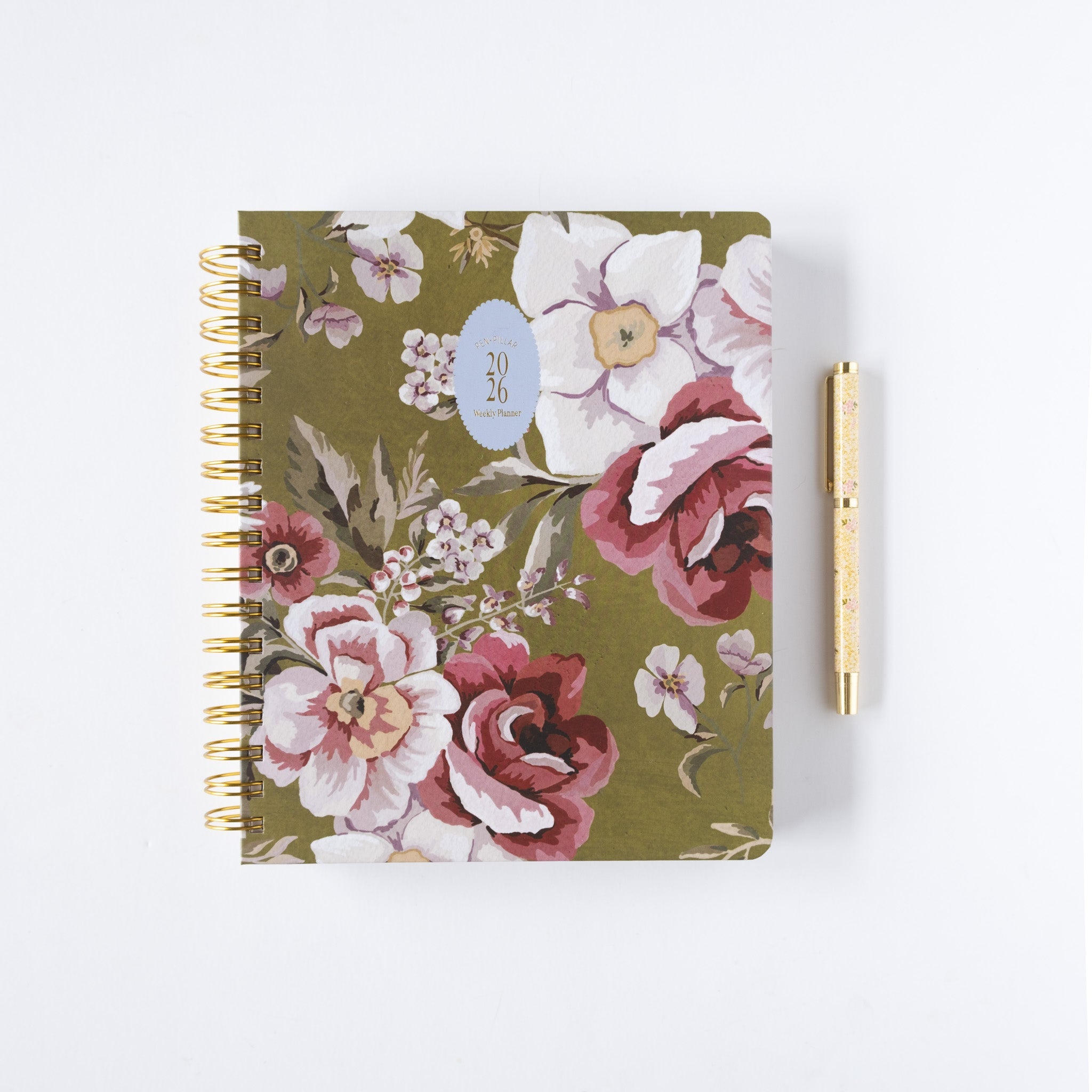 2026 planner bundle featuring a floral design with gold spiral binding and a gold pen beside it.