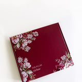 2026 planner bundle in a burgundy box with floral design on the front, featuring the text "Pen-Pillar 2026 Planner.