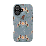 Prairie personalized iPhone case featuring a blue background with horse and floral patterns, and a monogrammed letter 'A'.
