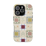 Patchwork personalized iPhone case featuring a colorful quilt design with various geometric patterns and soft colors.