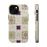 Patchwork personalized iPhone case featuring a multicolored quilt pattern with squares and floral designs.