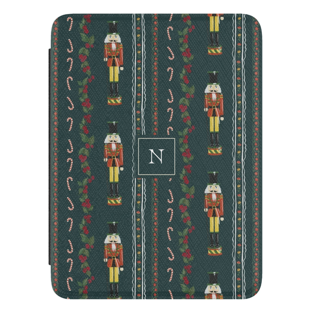 Nutcracker Personalized Kindle case, close-up of the front: nutcrackers, candy canes and holly garlands on deep green with the initial N