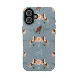 Prairie personalized iPhone case featuring a blue background with floral and horse patterns, and a monogrammed letter "A".