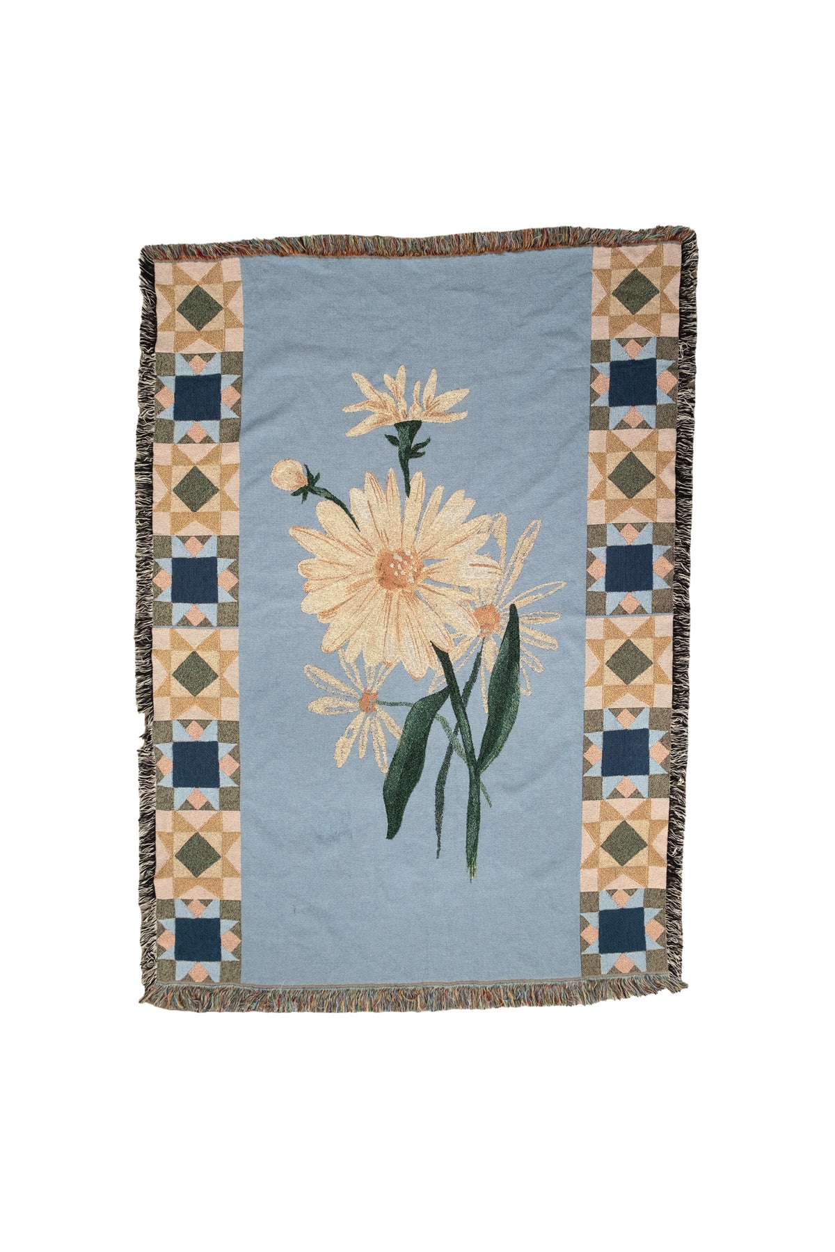 Light blue woven fabric blanket featuring a center daisy flower and geometric patterned borders with fringed edges.