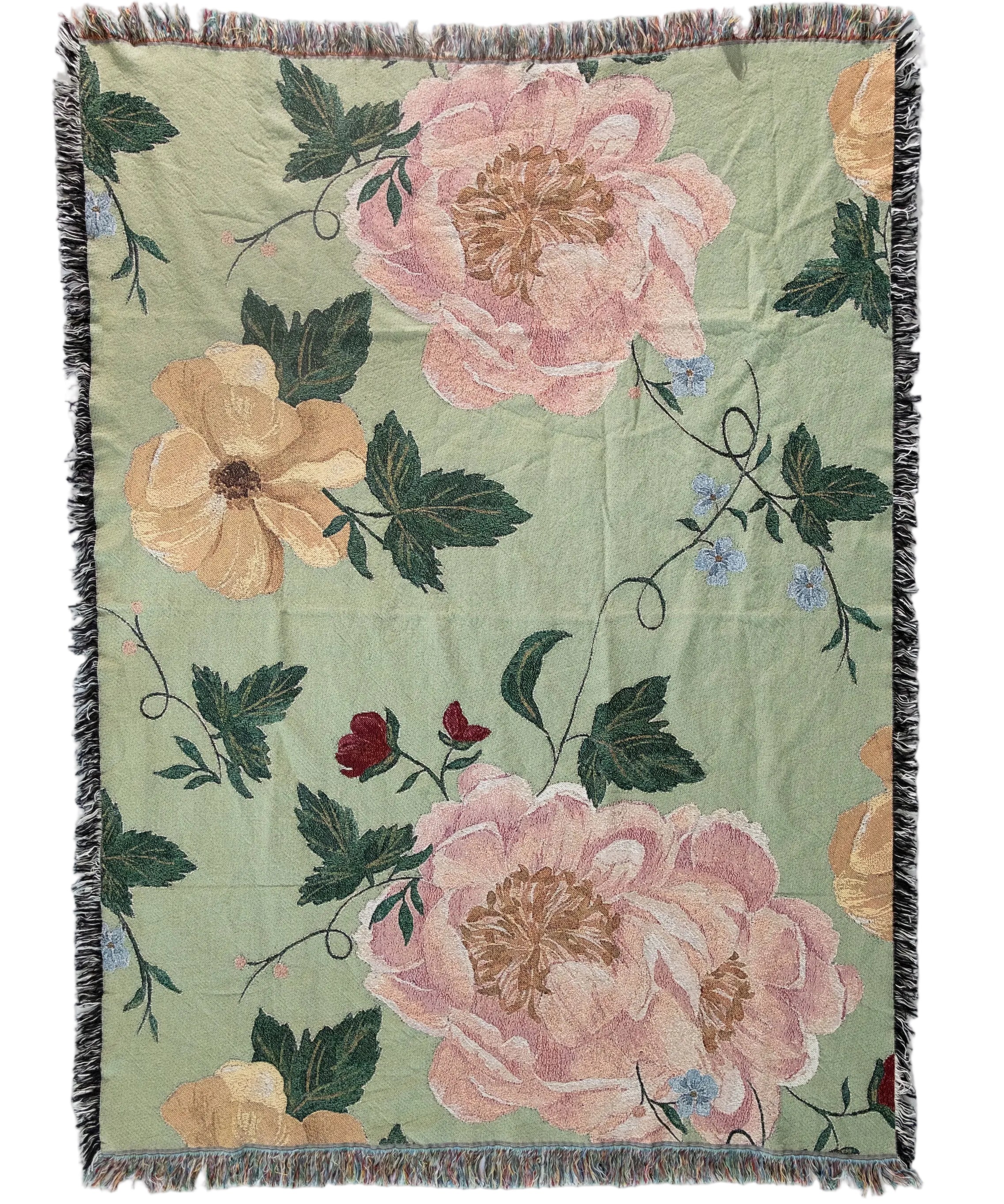 Floral patterned throw blanket with pink and orange flowers on a green background
