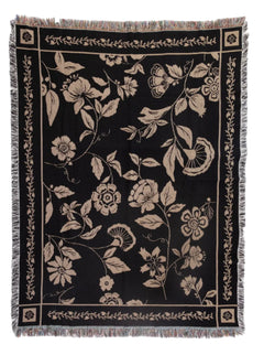 Floral patterned throw blanket on a white background