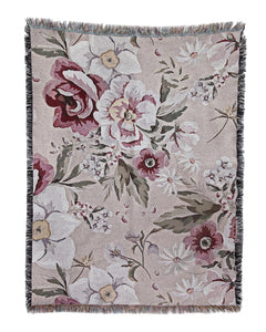 Floral patterned throw blanket on a white background