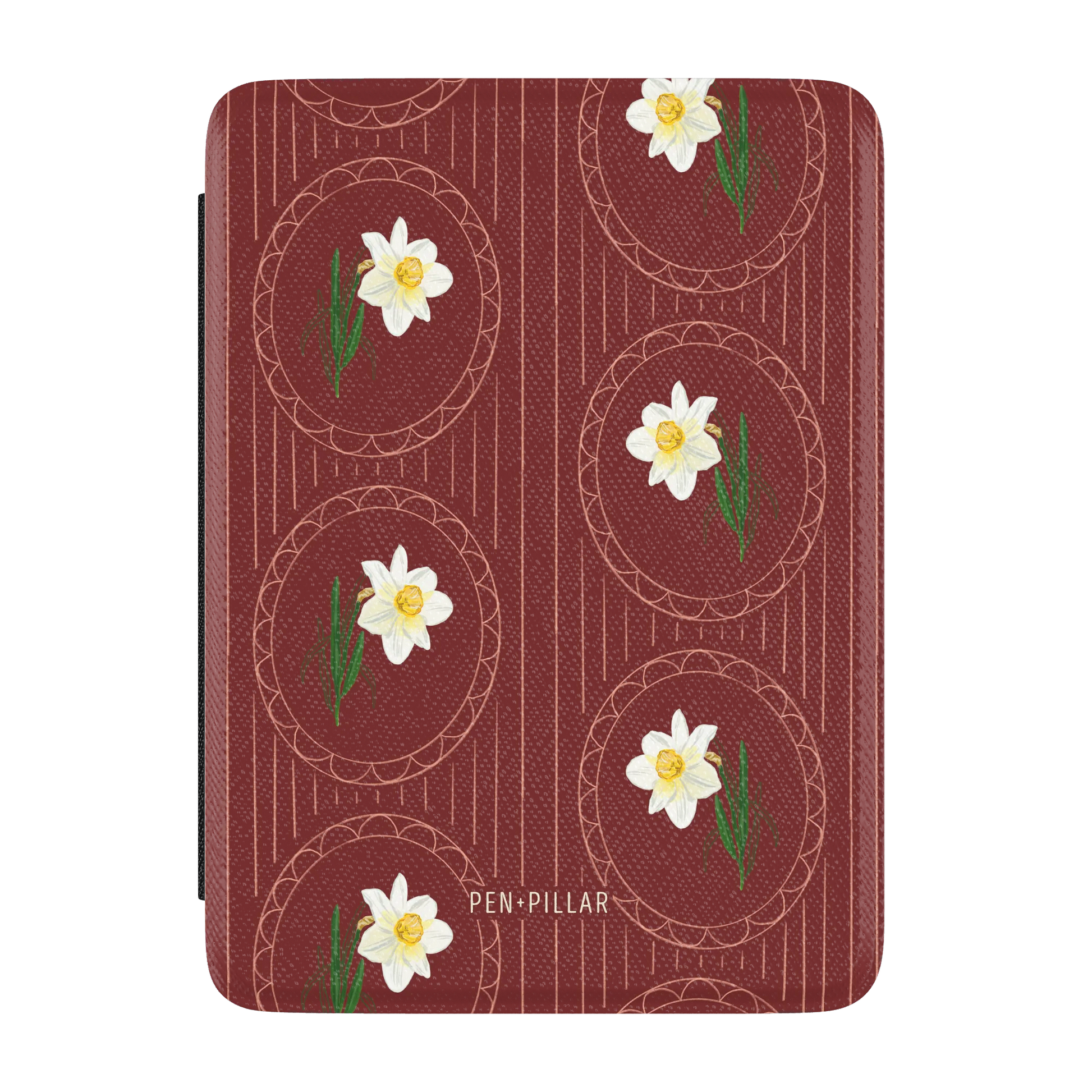 Red Kindle case with a white narcissus flower pattern in oval frames and PEN+PILLAR printed in white text.