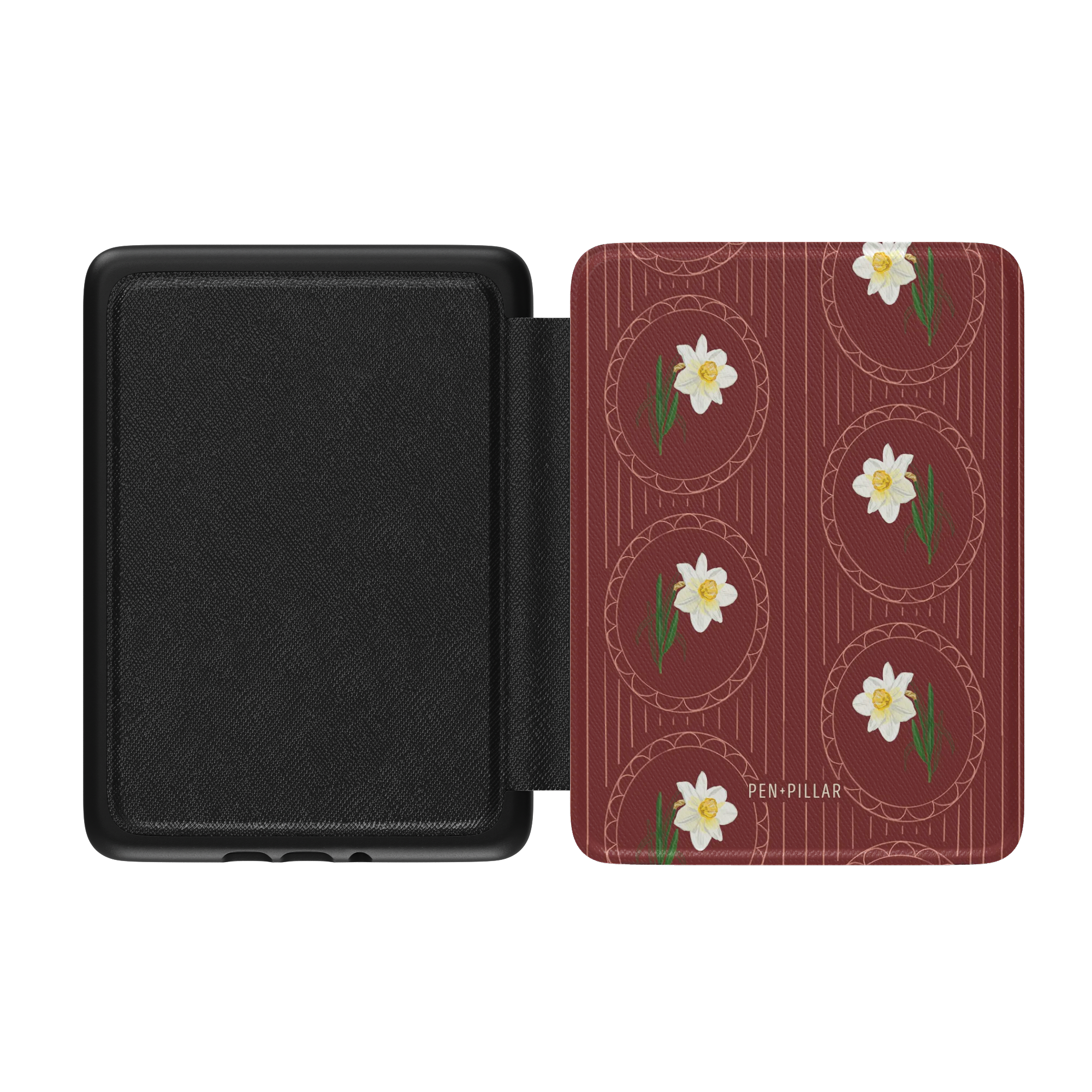 Open black Kindle case with a red floral cover featuring white narcissus flowers in circles and the text PEN+PILLAR.