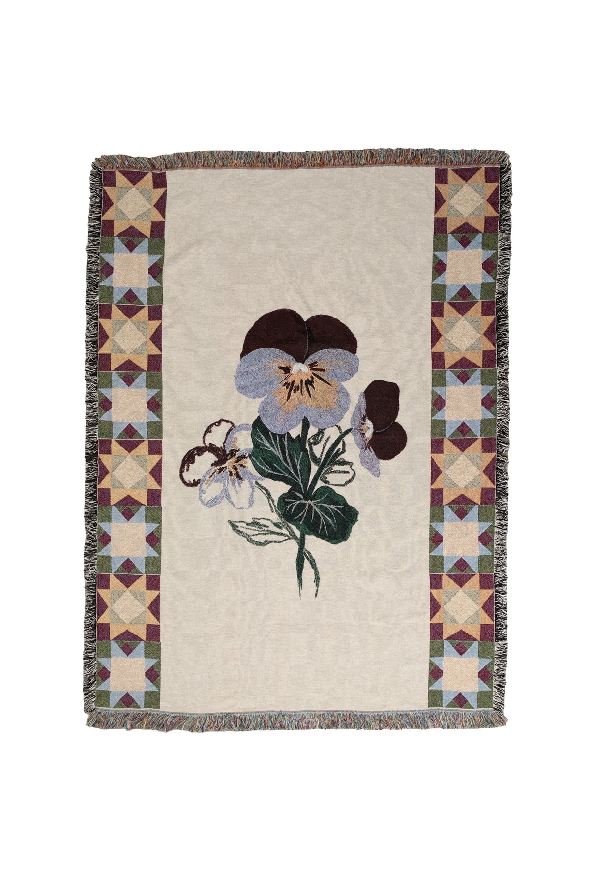 Rectangular woven fabric blanket with a center violet flower and geometric star borders in purple, green, and gold.