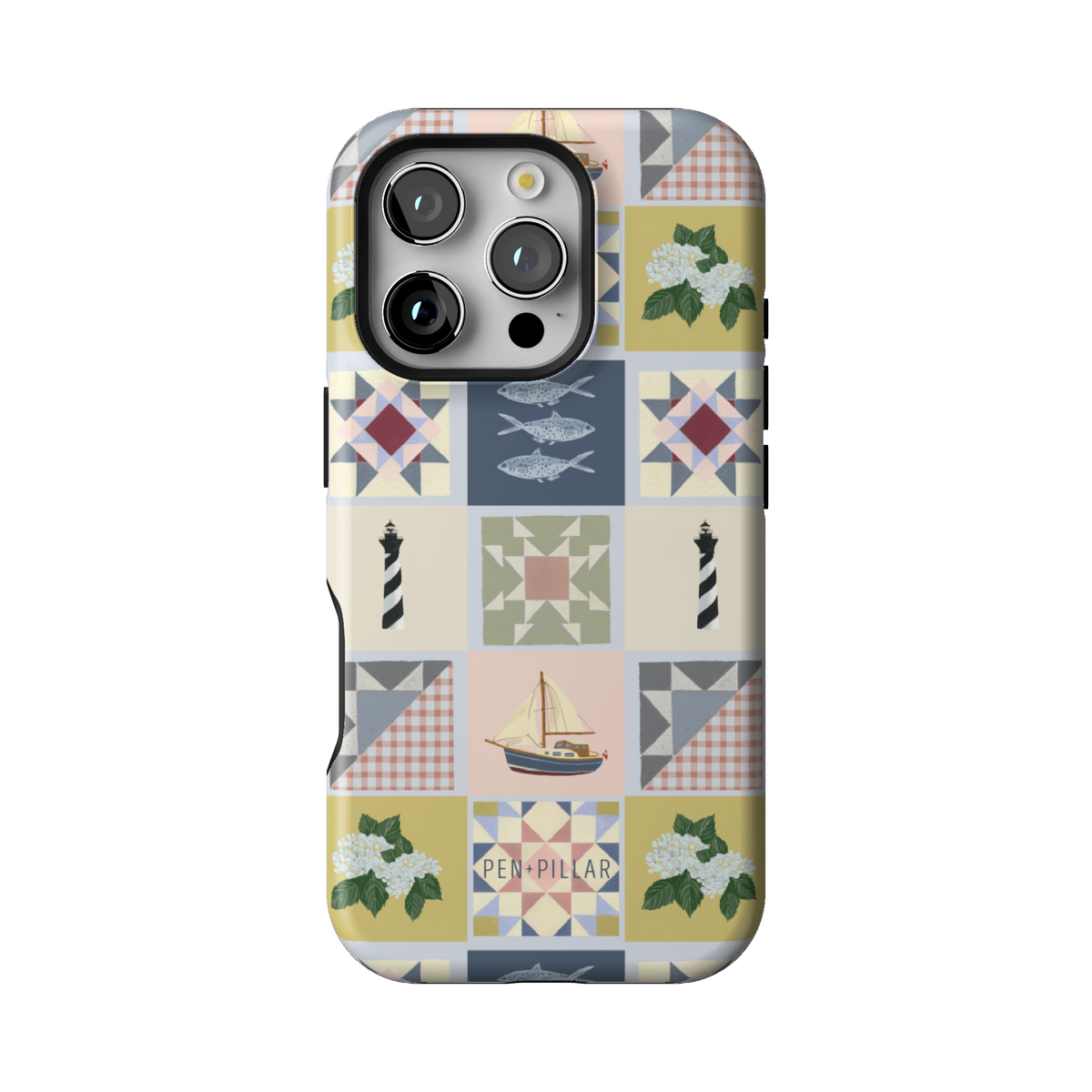 Coastal Quilt case on iPhone 16 Pro, back view: quilt blocks with sailboats, fish, a lighthouse and hydrangeas in navy, sage and blush