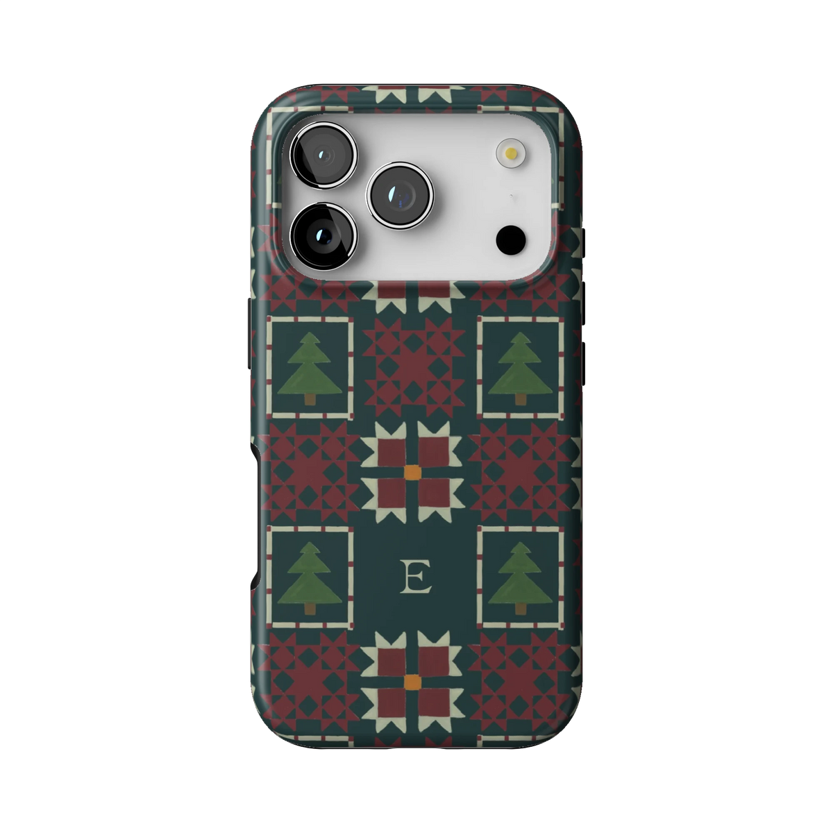Evergreen Personalized case on iPhone 17 Pro, back view: deep green quilt blocks with red stars and small pine trees with the initial E