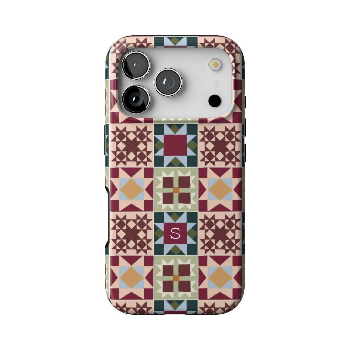 Sugarplum Personalized case on iPhone 17 Pro, back view: quilt blocks in burgundy, forest green, blush and gold with the initial S
