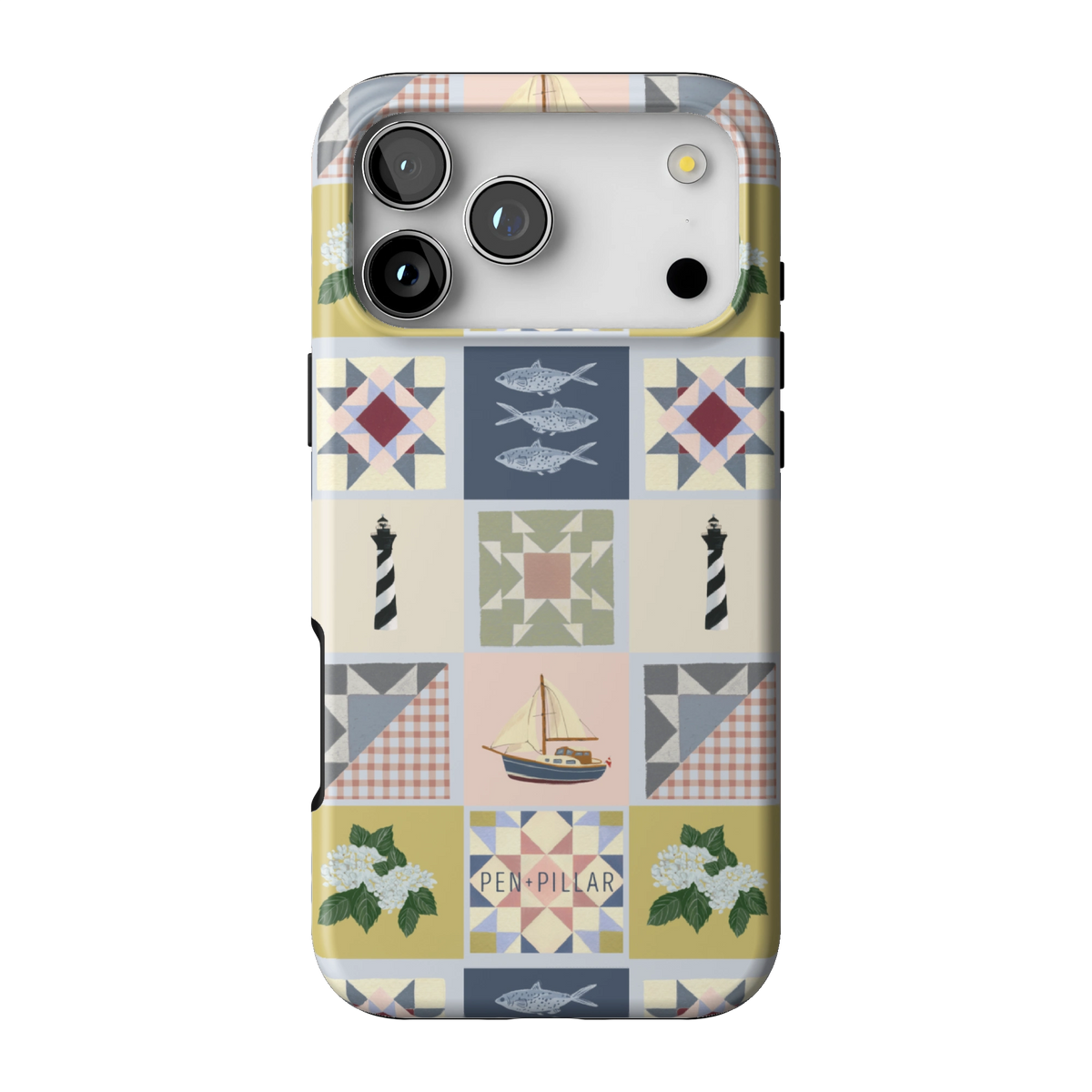Coastal Quilt case on iPhone 17 Pro Max, back view: quilt blocks with sailboats, fish, a lighthouse and hydrangeas in navy, sage and blush