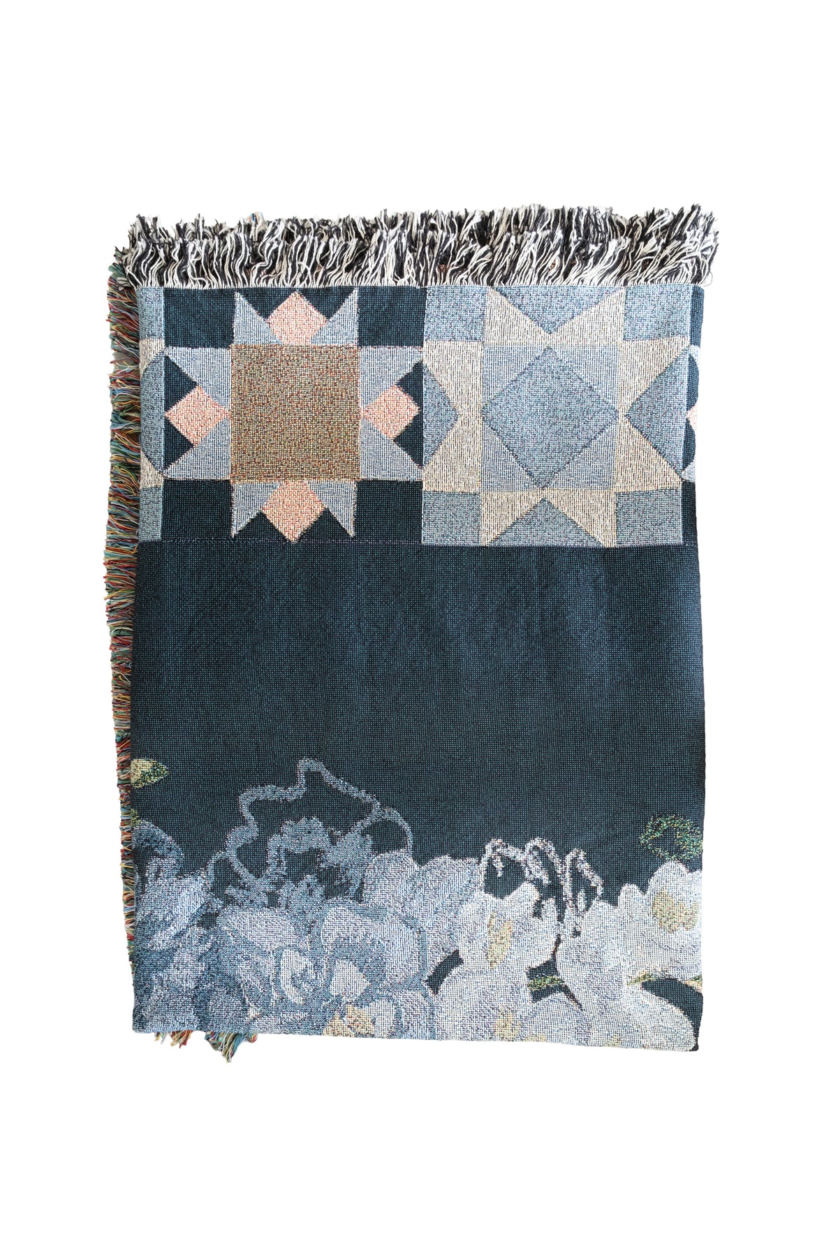 Folded dark blue woven fabric blanket with fringed edges, geometric star patterns, and light blue floral designs.