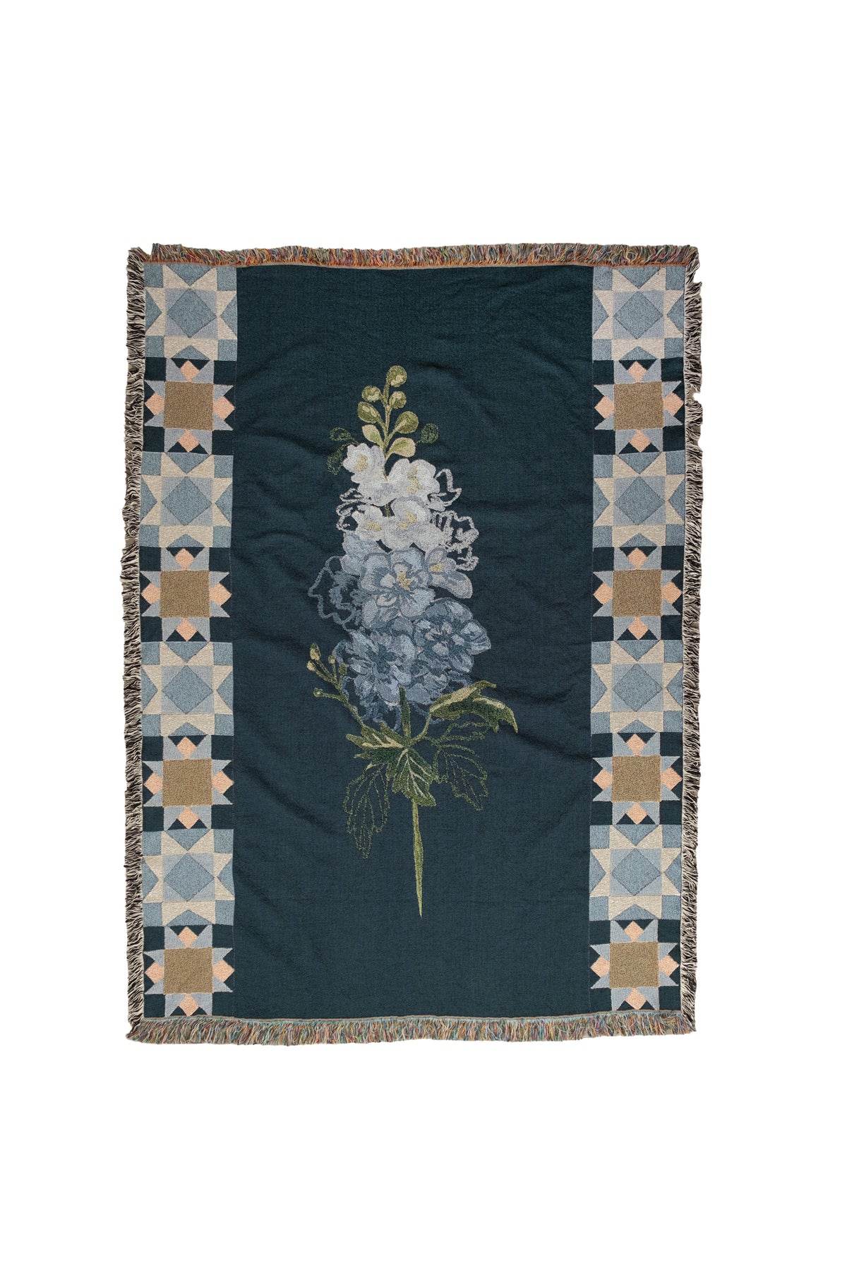 Dark teal woven fabric blanket with a central blue larkspur flower and geometric star borders.