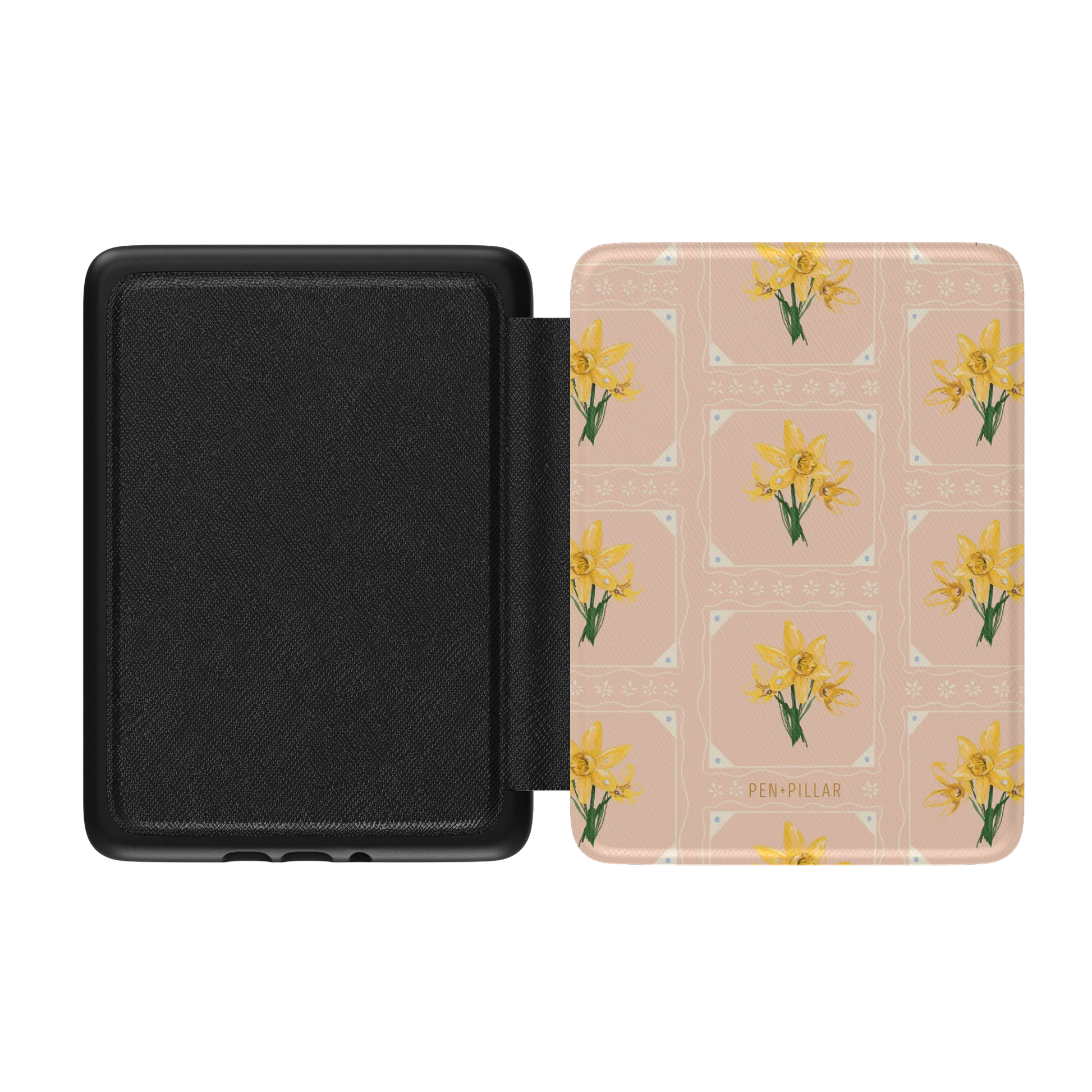 Open black Kindle case with a peach cover featuring yellow daffodil patterns and the PEN + PILLAR brand name.