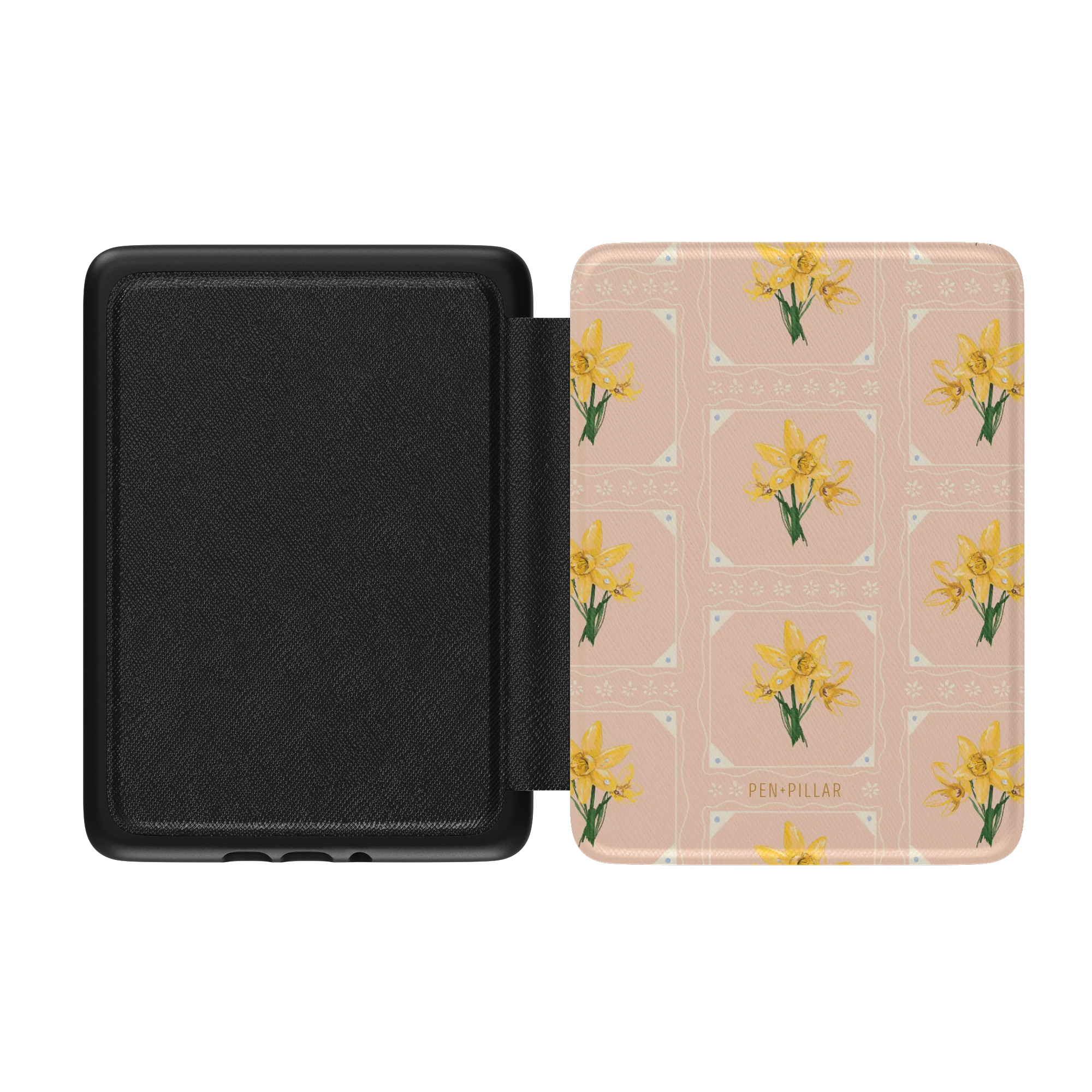 Open black Kindle case with a peach cover featuring yellow daffodil patterns and the PEN + PILLAR brand name.