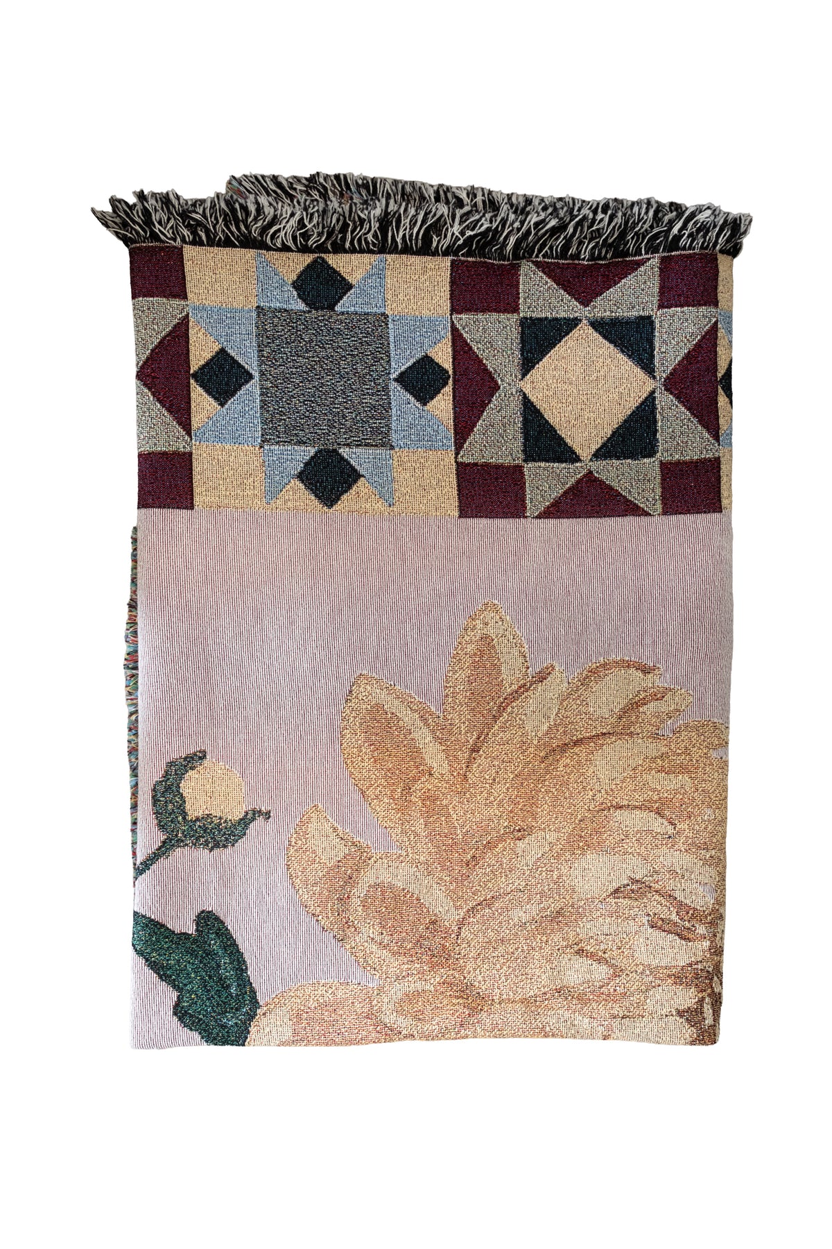 Folded woven fabric blanket with a large yellow flower, geometric star patterns, and a fringed top edge.