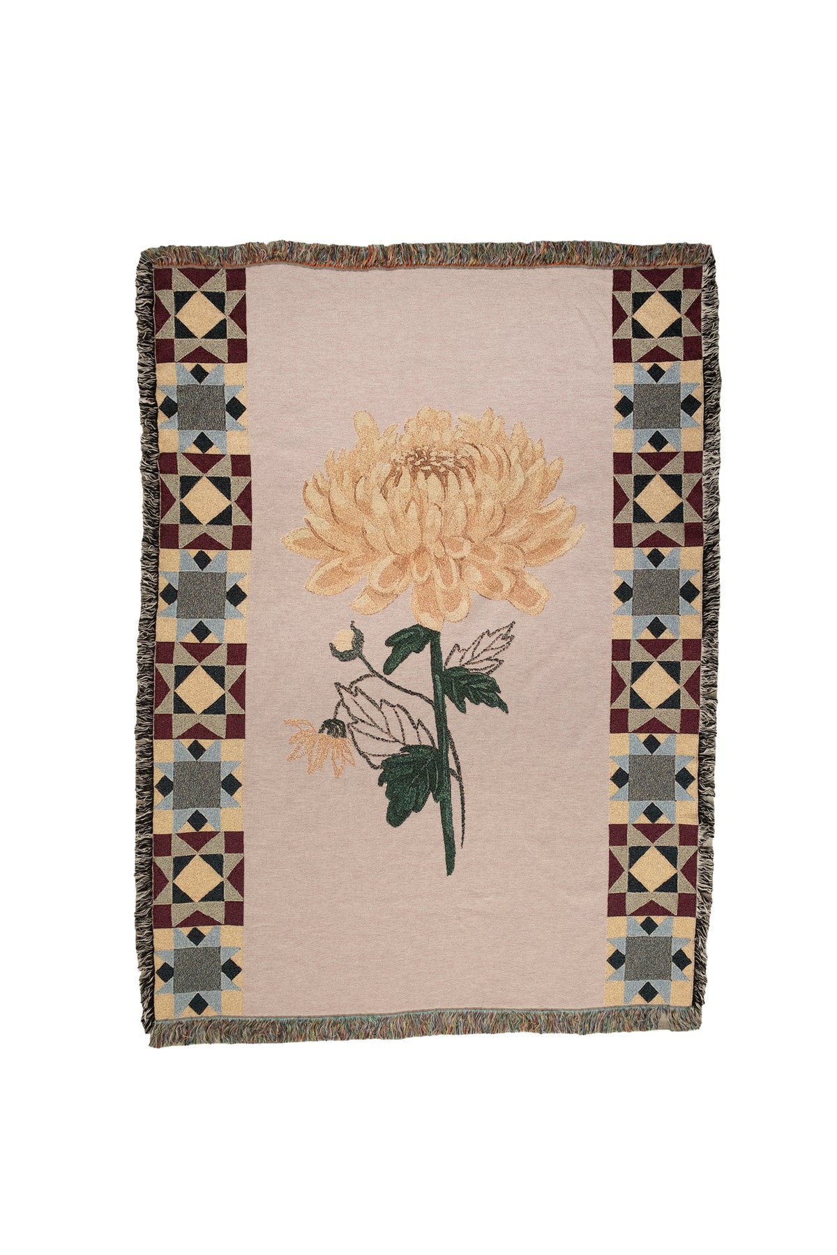 Rectangular woven fabric blanket with a yellow chrysanthemum flower and geometric patterned borders on a cream background.