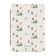 Slopes Kindle case, front cover: little skiers and snowy pine trees on cream