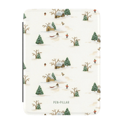 Winter Village Kindle case, front cover: a snowy village with cottages, sledders and evergreens