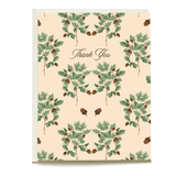 Thank you card featuring acorn and leaf patterns on a light peach background.