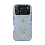 Artichoke iPhone case featuring a light blue background with floral patterns and a detailed artichoke design.