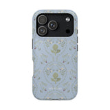 Artichoke iPhone case featuring a light blue background with floral patterns and a detailed artichoke design.