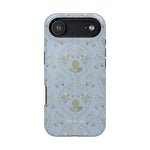 Artichoke iPhone case featuring a light blue background with floral patterns and a central artichoke design.