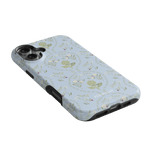 Artichoke iPhone case featuring a light blue background with floral patterns and artichoke illustrations.