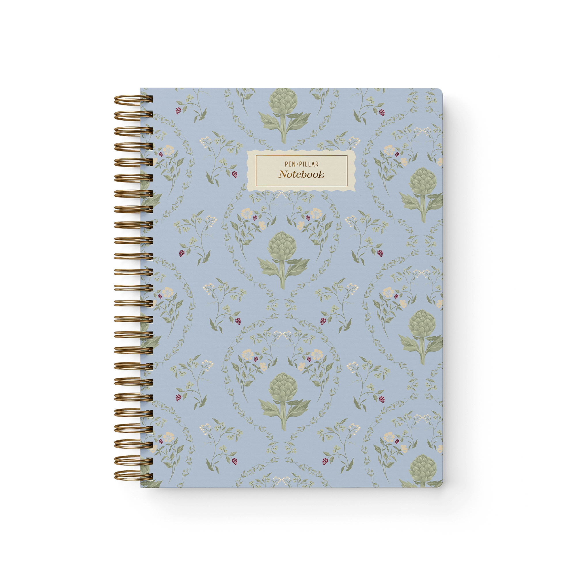 Artichoke notebook with a light blue floral design and gold spiral binding, featuring a label that reads "Notebook.