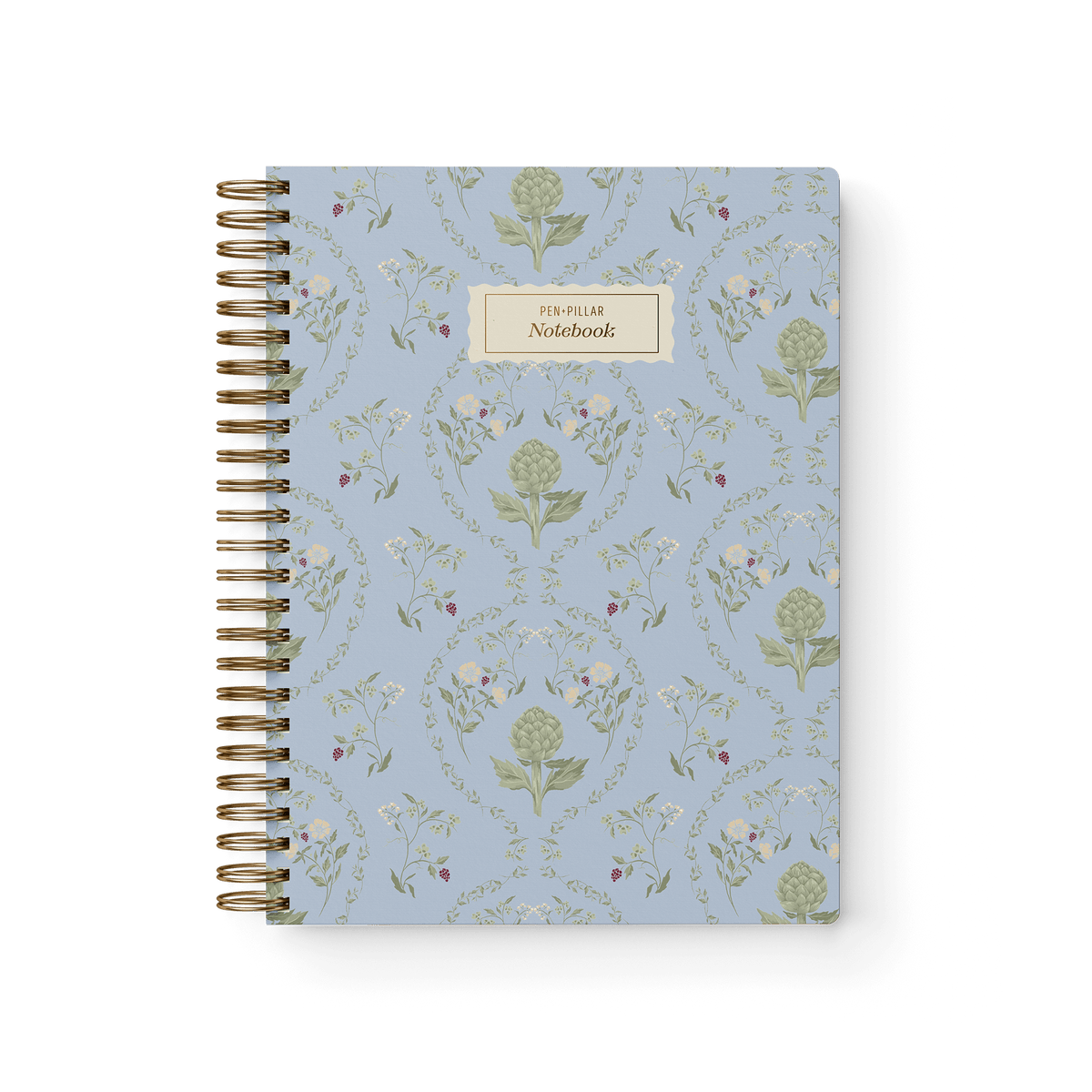 Artichoke notebook with a light blue floral design and gold spiral binding, featuring a label that reads "Notebook.