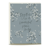 Baby's breath wedding card featuring floral design and handwritten text on a blue background.