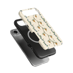Beehive iPhone case featuring a floral design with bees on a cream background, layered over a black phone case.