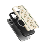 Beehive iPhone case featuring a floral design with bees on a cream background, layered over a black phone case.