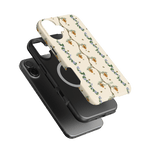 Beehive iPhone case featuring a floral design with bees on a cream background, stacked with a black case.