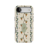 Beehive personalized iPhone case featuring floral patterns, bees, and a central monogram on a cream background.