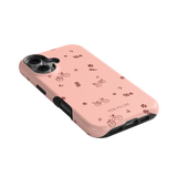 Bike Ride iPhone case in pink with bicycle and flower patterns, featuring a black edge and cutouts for buttons.