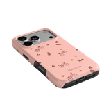 Bike Ride iPhone case in pink with bicycle and flower patterns, featuring a black edge for added protection.