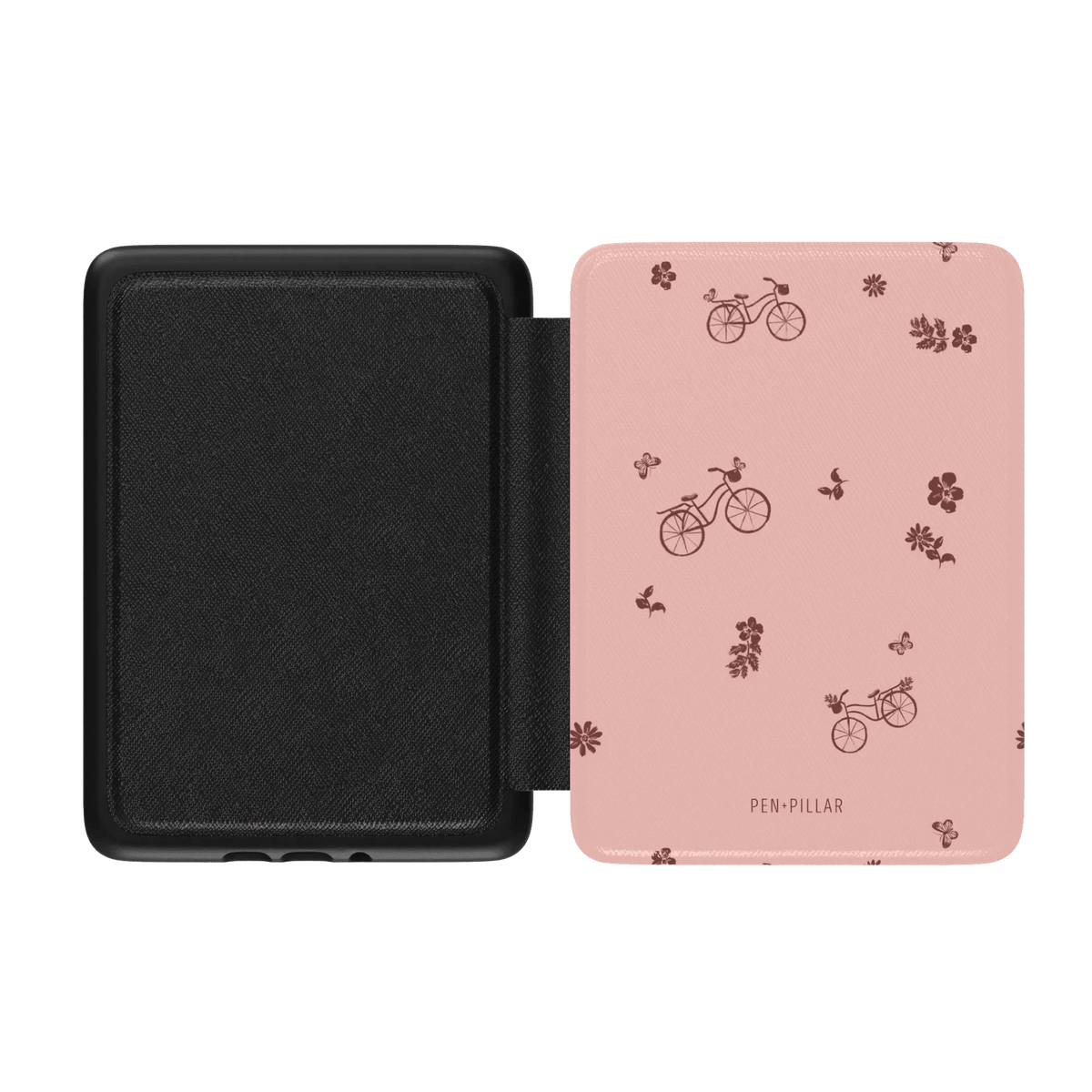 Bike Ride Kindle case featuring a pink exterior with bicycle and flower patterns, black interior, and a magnetic closure.