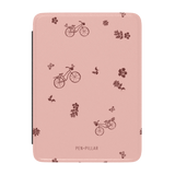 Bike ride Kindle case featuring a pink background with brown bicycle and floral patterns.