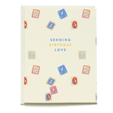 Birthday stamps card featuring colorful stamps and the text "Sending birthday love" on a cream background.